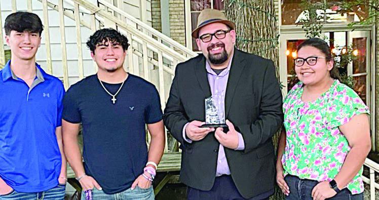 Band Director Aw ard – Justin Bartlett (second from right), Schulenburg ISD head band director, was presented an award by 2022 alumni (from left) Kael Baumgarten, Jorge Olvera and (right) Karla Rico, for his hard work and dedication over the past three years to the band program and students of Schulenburg ISD