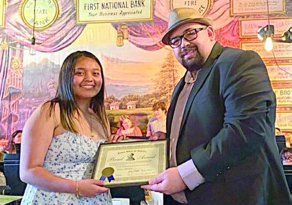 John Phillip Sousa Aw ard was presented to Yahaira Guerrero (left) by SISD band director Justin Bartlett (right).