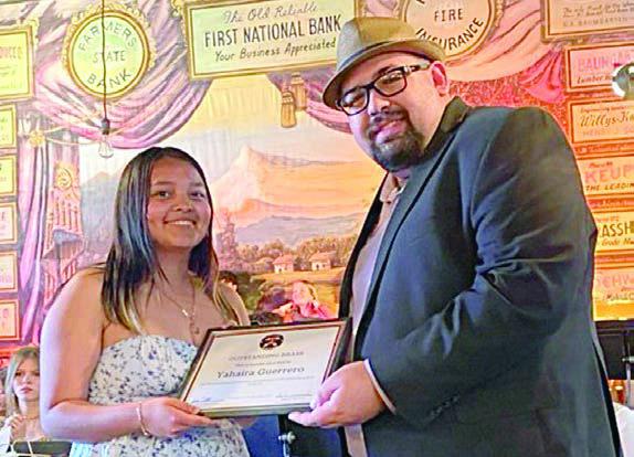 Outstanding Brass Aw ard was presented to Yahaira Guerrero (left) by SISD band director Justin Bartlett (right).