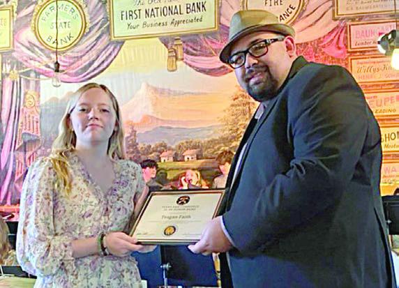 Honor Band – Teagan Faith (left) received a certificate for selection into the Texas A&amp;amp;M Commerce Junior/Senior Honor Band from Justin Bartlett (right).