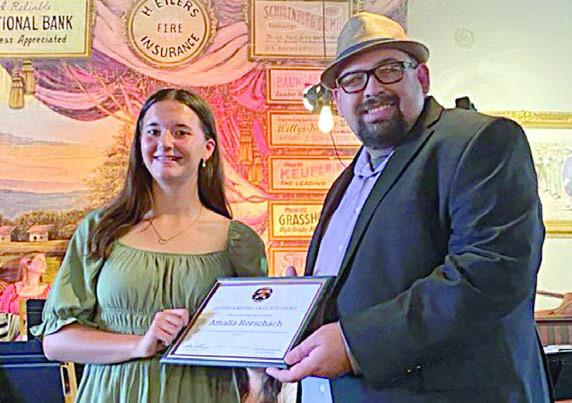 Outstanding Jazz Student Aw ard was presented to Amalia Rorschach (left) by SISD band director Justin Bartlett (right).