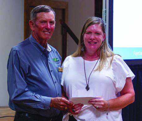 CASA of Bastrop, Fayette and Lee Counties received a $5,000 grant from FEC and CoBank. Shown are (from left) FEC board president David Lehmann and CASA executive director Kristi Bauer.