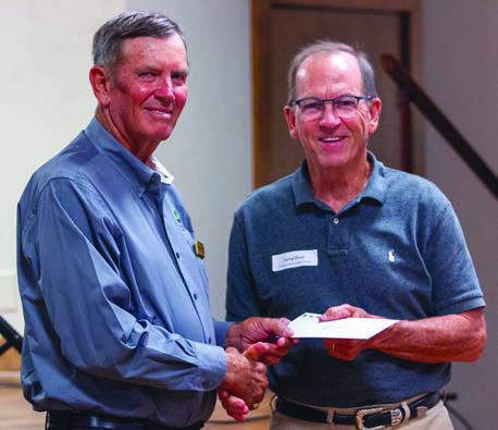 Flatonia Area Food Pantry received a $5,000 grant from FEC and CoBank. Shown are (from left) FEC board president David Lehmann and Flatonia Area Food Pantry director of development Larry Haas.
