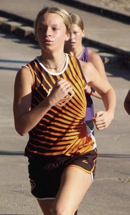 Michaela Kollmann turns up a hill en route to placing 10th. Sticker Photo By Darrell Vyvjala