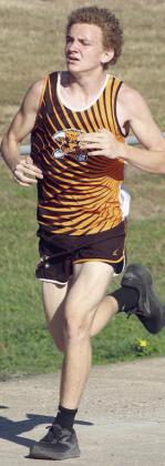 Alton Herzik crosses the bridge midway through the race, trailing only one competitor. He finished as the district runner-up. Sticker Photo By Darrell Vyvjala