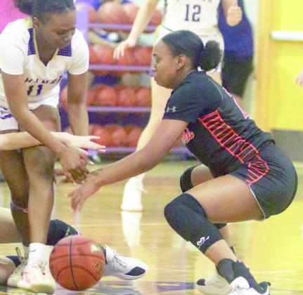 Jashiya Jackson cause a turnover in the third period. Sticker Photo By Darrell Vyvjala