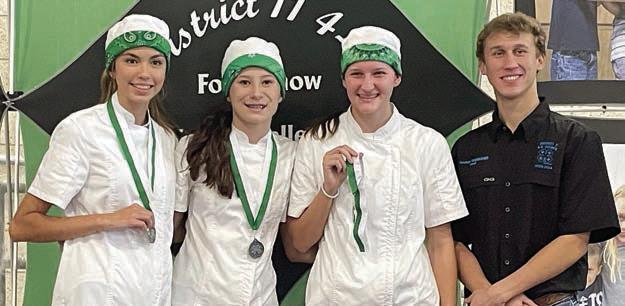Creative Cooks – (from left) Tori Newton, Eleanor Carey and Elena Supak of the La Grange 4-H and a District 11 4-H Council officer.