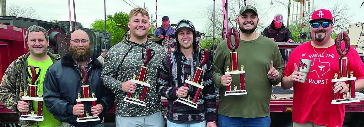 SAUSAGE TOSS - ADULT DIVISION: (from left) Clayton Weishuhn and Brasly Vitek, third place; Jaxon Fietsam and D.J. Taylor, second place; and Dalton Abendroth and Mason Florus, first place. Sticker Photo By Darrell Vyvjala