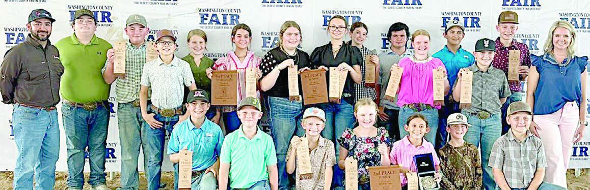 Fayette County 4-H members participating in the Washington County Livestock Judging Contest were (front row, from left) Crockett Guenther, Jehnsen Janecka, Joe Carrales, Abigale McBride, Emma Zwescpher, Rowdy Guenther, Parker Gabler, (back row) coach JoJo Carrales, Rilan Karisch, Abraham McBride, Tate Fritsch, Hayleigh Pizzitola, Adalyn Carrales, Rheagan Karisch, Tatum Fritsch, Laramie Laake, Logan Poncik, Kaisley Janecka, Dylan Zweschper, Hudson Holub, Holden Holub and coach Kaci Carrales.