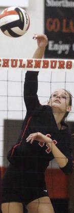 Emmrie Marx registers a kill in the third set against Ganado. Sticker Photo By Darrell Vyvjala