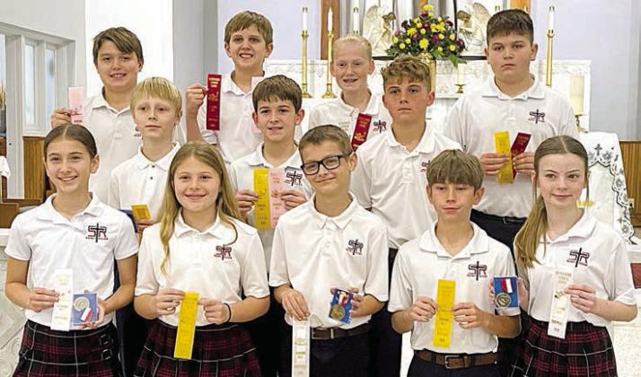 Grades 5-6 Winners – (front row, from left) Brielle Goedrich, Brylee Stoever, Andrew Besetzny, Barrett Redman, Rylee Wright, (middle row) Sebastian Lincoln, Luke Goedrich, Jack Schiffli, (back row) Noah Heger, Levi Johnson, Briley Hartensteiner and John Schmidt.