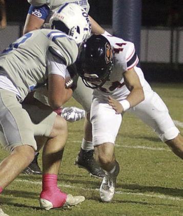 Koi Prihoda makes a fourth-down stop in the first quarter. Sticker Photo By Darrell Vyvjala