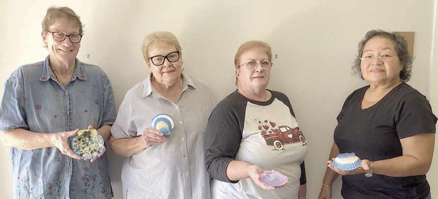 Artful Friday gained two new members recently. They joined in a quick craft of painting scallop shells led by instructor Georgia Pohl. The two new members are Maxine Farley (second from left), the grandmother of the program director for Arts for Rural Texas, Tory Farley, and her friend Jan Willette (second from right), an excellent baker who brought a delicious cake to share. They are shown with Berni Gillings (left) and Amparo Salinez (right).