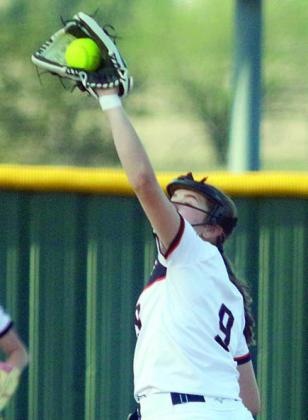 Shortstop Kerr McBride makes a running catch of a Ladycat popup. Sticker Photo By Darrell Vyvjala