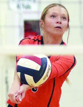 Michaela Kollmann passes on serve receive in the first set. Sticker Photo By Darrell Vyvjala