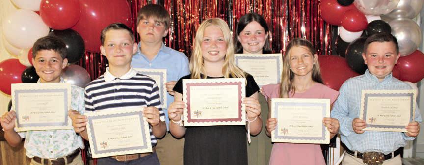 Top 5th Grade Students – (from left) Cal Schiffli, math, reading, science and social studies; Cannon Lykke, band; Bryson Ohnheiser, computer; Brynlee Berger, religion; Charlotte Schmidt, band most improved; Clare Besetzny, reading, English and band; and Abraham McBride, computer.
