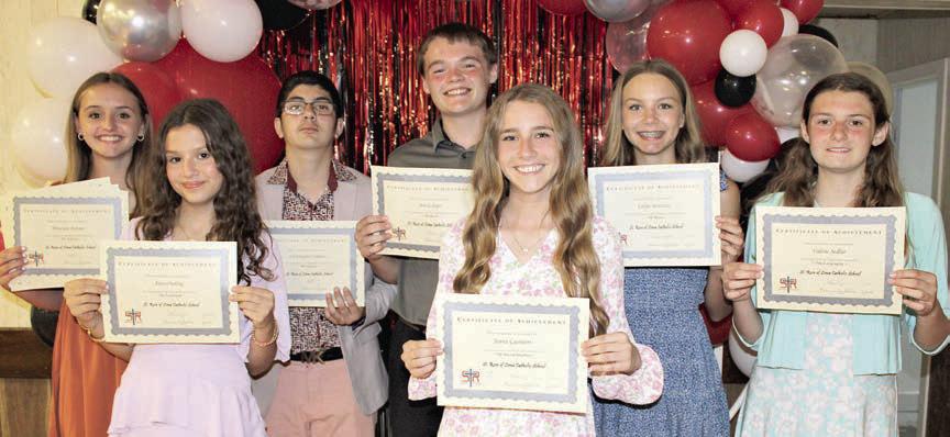 Top 7th Grade Students – (from left) Miranda Bonner, math, reading, science, English, religion, social studies and band; Anna Oeding, yearbook; Christopher Campos, Spanish; Brock Seger, band; Jenna Guentert, social studies; Layne Besetzny, band most improved; and Valerie Sedlar, geography.