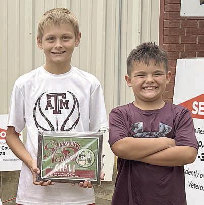 CASI chili showmanship 1st Place – “Tricky Pig” of Schulenburg, represented by (from left) Andrew Besetzny and Michael Cunningham. 2nd – Beer 30 Cookers of Schulenburg. 3rd – Cowgirls Kick Butt of Red Rock. Sticker Photo By Layne Vyvjala