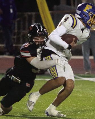 Emerson Harvey sacks Ayden Ramirez for a loss of 10 in the first quarter. Sticker Photo By Darrell Vyvjala