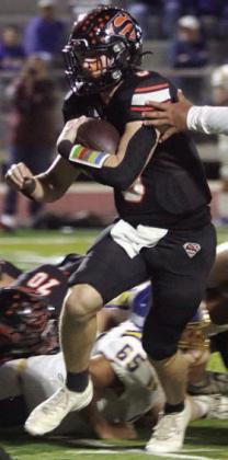 Owen Brenek breaks free for the Horns first touchdown. Sticker Photo By Darrell Vyvjala
