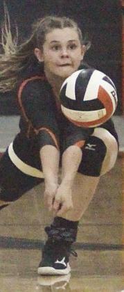 Haylee Vacek gets to a Brazos attack in game two on Friday. Sticker Photo By Darrell Vyvjala