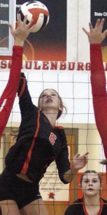 Clara Magliolo splits a pair of Brazos blockers for a kill in the third set. Sticker Photo By Darrell Vyvjala