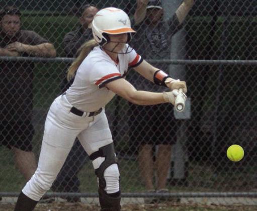 Angel Davis drops down a bunt for a hit in last Monday’s home game. Sticker Photo By Darrell Vyvjala