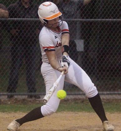 Hailey Kahlden connects with a Lady Comanche pitch for a single up the middle. Sticker Photo By Darrell Vyvjala