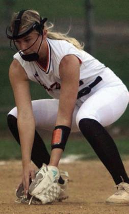 Third baseman Olivia Mathis gloves a Lady Comanche grounder. Sticker Photo By Darrell Vyvjala
