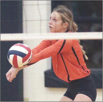 Michaela Kollmann delivers a pass in game three. Sticker Photo By Darrell Vyvjala