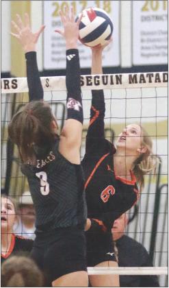 Clara Magliolo gets a kill in the first set. Sticker Photo By Darrell Vyvjala