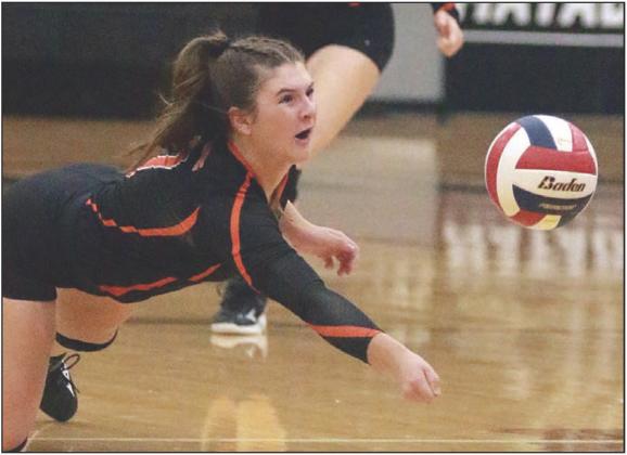 Landry Zapalac makes a diving dig attempt in game two. Sticker Photo By Darrell Vyvjala