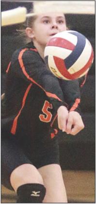 Haylee Vacek sends a pass on its way in the second set. Sticker Photo By Darrell Vyvjala