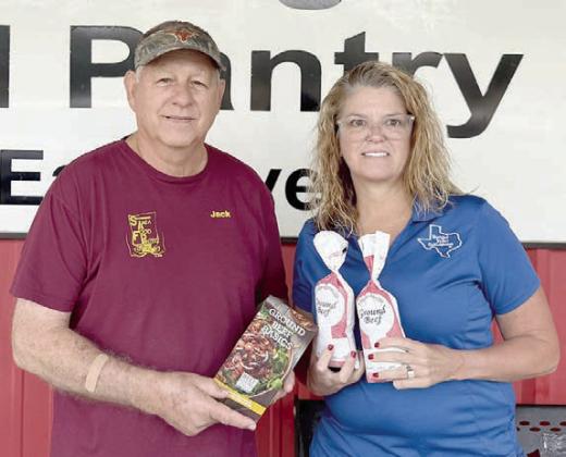On behalf of Navidad Valley CattleWomen, past president Tanya Schindler (right) delivered 33 pounds of hamburger to the Schulenburg Area Food Pantry. Jack Niesner (left), SAFP vice president, holds some of the high-quality recipes and materials received from the “beef loving Texans.”