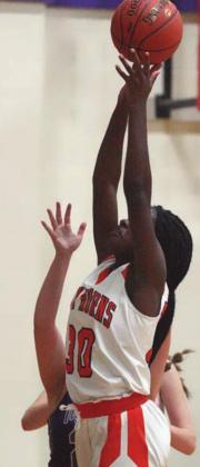 Jessalyn Gipson goes up for a bucket in the first half after an offensive rebound. Sticker Photo By Darrell Vyvjala