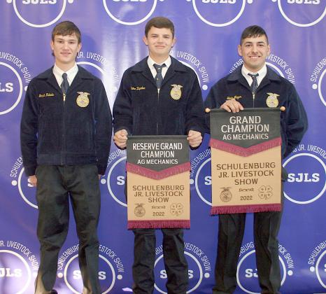 AG MECHANICS SHOW – From left: Grant Kubala, Blaine Zapalac, and (not shown) Kenny Schramek, John Vacek, and Jacob Vacek, reserve champions for their cattle squeeze chute. Right: Blake Meyer, grand champion for his 16-foot utility trailer. Sticker Photo By Darrell Vyvjala