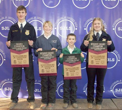 PROFICIENCY TEST – From left: Grant Kubala, senior division grand champion; L. J. Schindler, junior division reserve champion; Crockett Guenther, junior division grand champion; and Haley Schramek, senior division reserve champion. Winner scored the best on a 15-question test over general livestock knowledge. Sticker Photo By Darrell Vyvjala