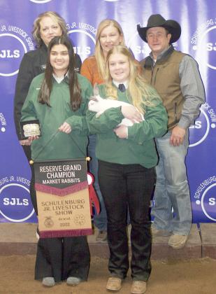 RESERVE CHAMPION MARKET RABBITS – Exhibitor: Haley Schramek (front, right).
