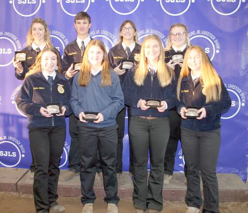 SHOWMANSHIP GRAND CHAMPIONS – Front, from left: Keaton Walker, breeding beef; Landry Zapalac, dairy; Jenna Matura, rabbits; and Harly Zapalac, breeding goat. Back, from left: Kloe Kutac, swine and breeding swine; Grant Kubala, steer; Carolyn Prihoda, broilers; and Dylann Kahlden, goat. Sticker Photo By Darrell Vyvjala