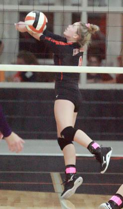 Avery Helms saves a ball in the back row during the second set. Sticker Photo By Darrell Vyvjala