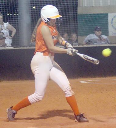 Tamara Otto sends a single to left field as part of the Lady Horns’ five-run  sixth inning in game three. Sticker Photo By Darrell Vyvjala