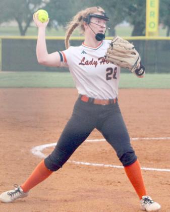 Pitcher Brianna Vavra first to first to record the third out of the fifth inning in  game one. Sticker Photo By Darrell Vyvjala