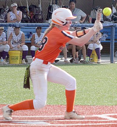 Brianna Vavra (center) gets to a high pitch to put down a sacrifice bunt in the first inning of game two. Sticker Photo By Darrell Vyvjala