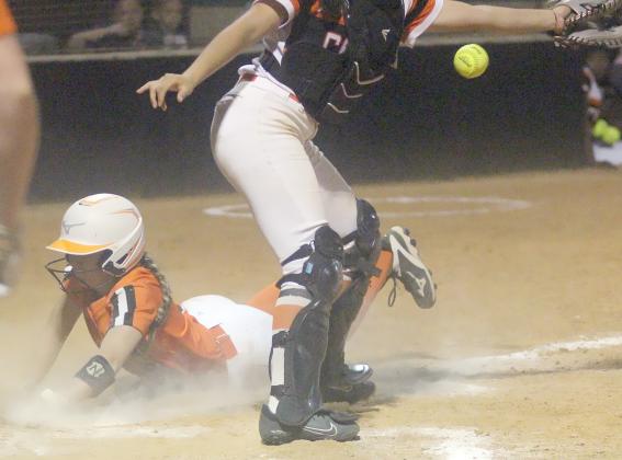 Keaton Walker slides home with a run in the bottom of the sixth inning in  game three. Sticker Photo By Darrell Vyvjala