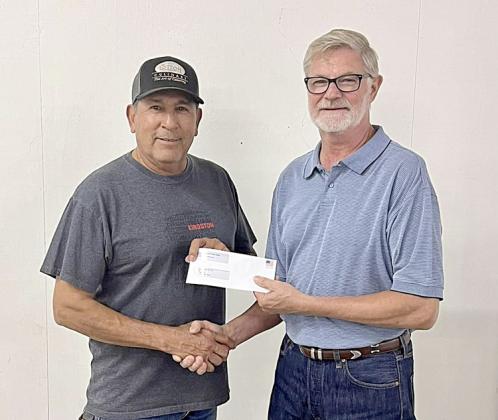 Knights of Columbus - La Grange received a donation of $1,249.50. Shown are (from left) KC representative Hector Cervantes and Fair president Mike Zuhn. Knights of Columbus’ contestant was Celeine Fabre.