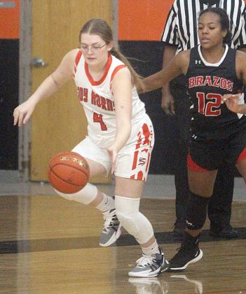 Haylee Norman comes up with a steal against Brazos. Sticker Photo By Darrell Vyvjala