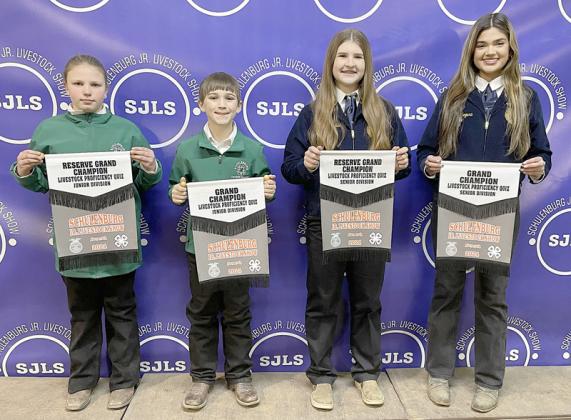 PROFICIENCY TEST – (from left) Olivia Hammack, reserve champion junior division; Crockett Guenther, grand champion junior division; Landry Zapalac, reserve champion senior division; and Klare Segura, grand champion senior division. Winners scored the best on a 15-question test over general livestock knowledge that covers beef, swine, goats, dairy, and broilers. Sticker Photo By Darrell Vyvjala