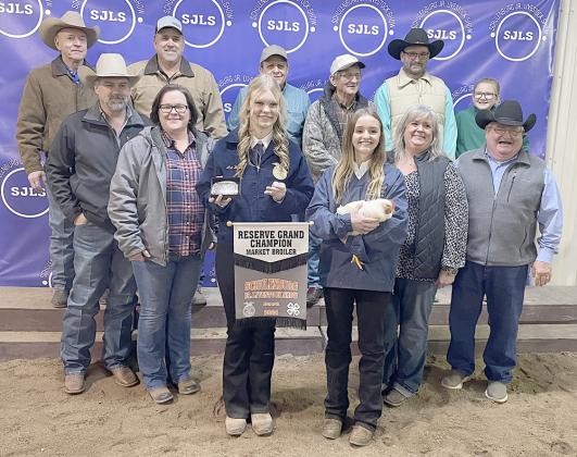 RESERVE CHAMPION MARKET BROILERS – Exhibitor: Miranda Bonner (front, third from right). Sales price: $5,150. Sticker Photo By Darrell Vyvjala