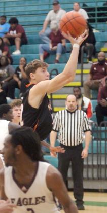 Van Prihoda hits a jump shot in the second  quarter. Sticker Photo By Darrell Vyvjala