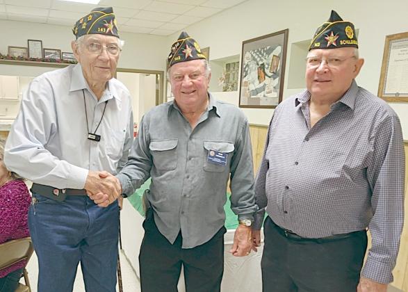 James Stanzel (left) is congratulated by Bob Heinrich (center), Post 143 commander, and Dennis Muhlstein (right), Post 143 adjutant, for attaining 75 years of membership with American Legion McBride Post 143.